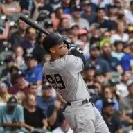 Yankees' Aaron Judge hits his fifty eighth homerun during the third inning of a baseball game against the Milwaukee Brewers.