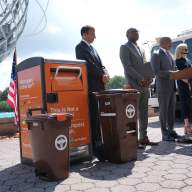 Mayor Adams stands with city officials to announce the Queens organics composting program