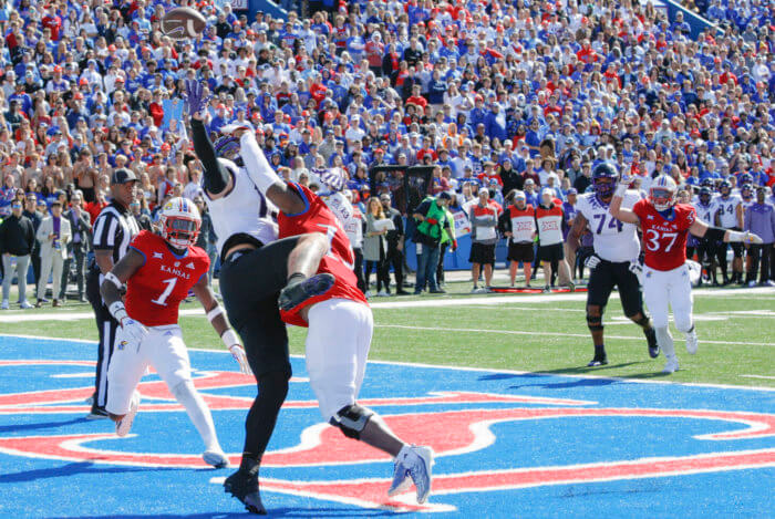 The Kansas Jayhawks break up a pass in the end zone