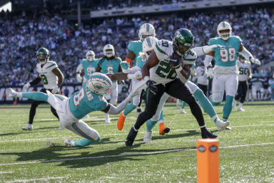Rookie Jets running back Breece Hall carries the ball down to the 1-yard line against the Miami Dolphins.