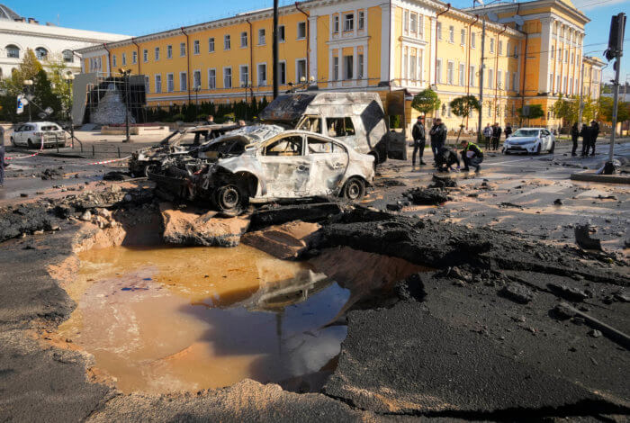 Police inspect the scene of Russian shelling in Kyiv, Ukraine, Monday, Oct. 10, 2022.