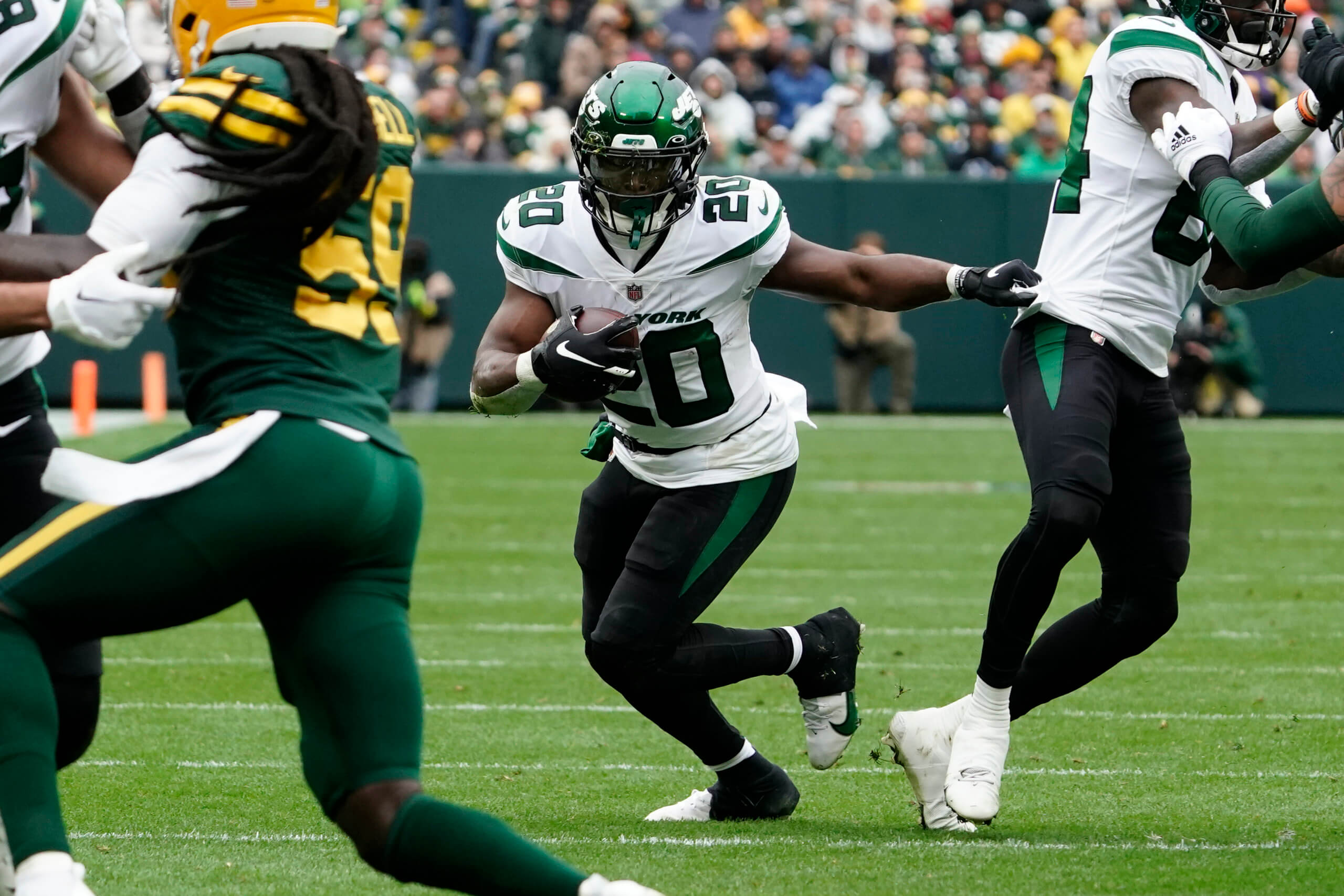 Jets running back Breece Hall breaks up field during the first half against the Packers in Week 6.