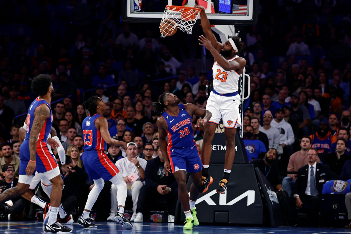 Knicks center Mitchell Robinson dunks over Detroit Pistons center Isaiah Stewart (28) during the first half.