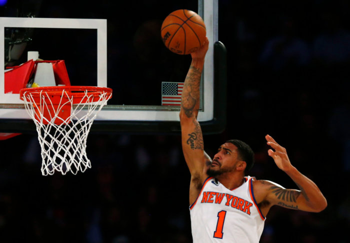 Knicks forward Obi Toppin dunks over Orlando Magic forward Paolo Banchero.