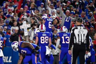 The Buffalo Bills celebrate a touchdown against the Packers