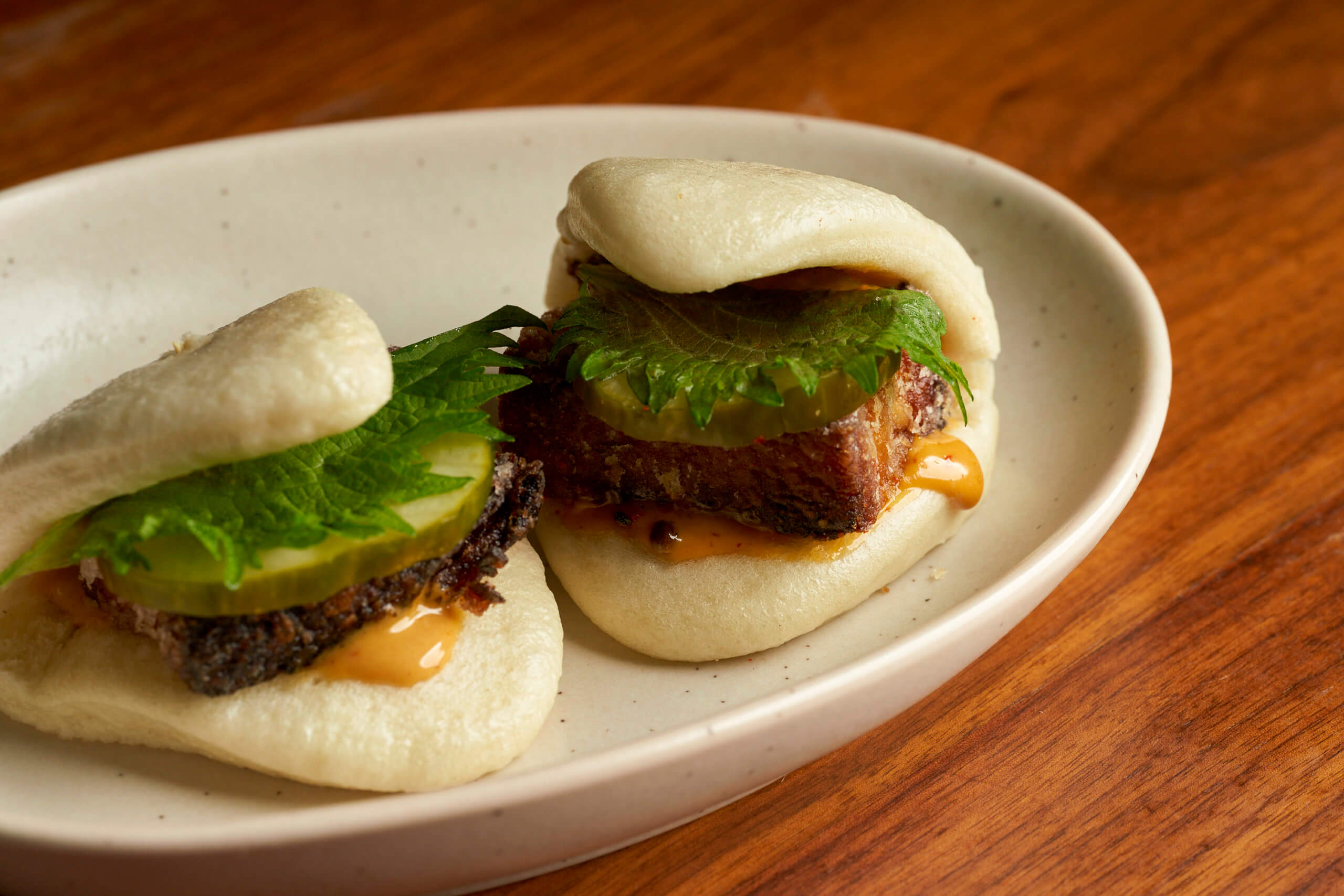 KYU's Crispy Pork Belly Steamed Buns.