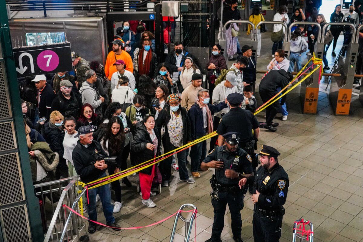 Man killed by train in Queens during fight; suspect in custody 2 Commuters in Queens affected after man hit by train at station