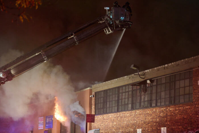 Four-alarm fire guts Queens warehouse