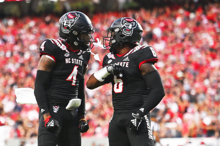 N.C. State's defense celebrates a stop in college football action