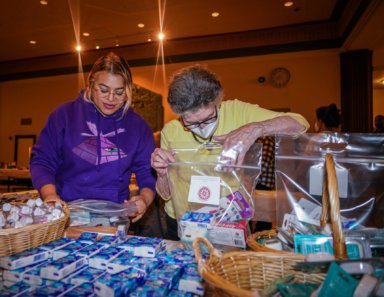 A real blessing: Volunteers return to Manhattan temple after two years to pack gifts for Mitzvah Day