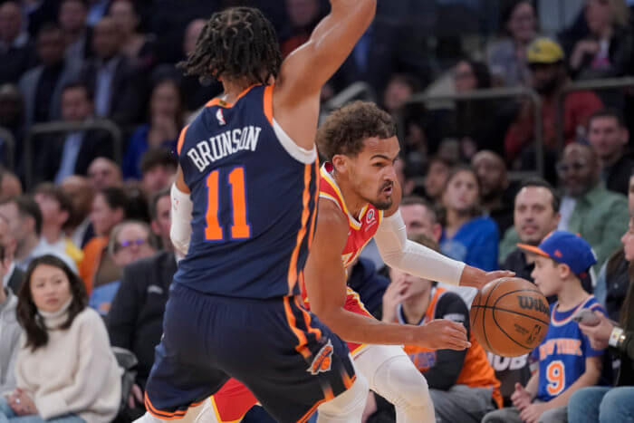 Trae Young drives on the Knicks Jalen Brunson