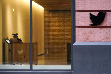 A receptionist works in the lobby of the building that houses the Twitter office in New York