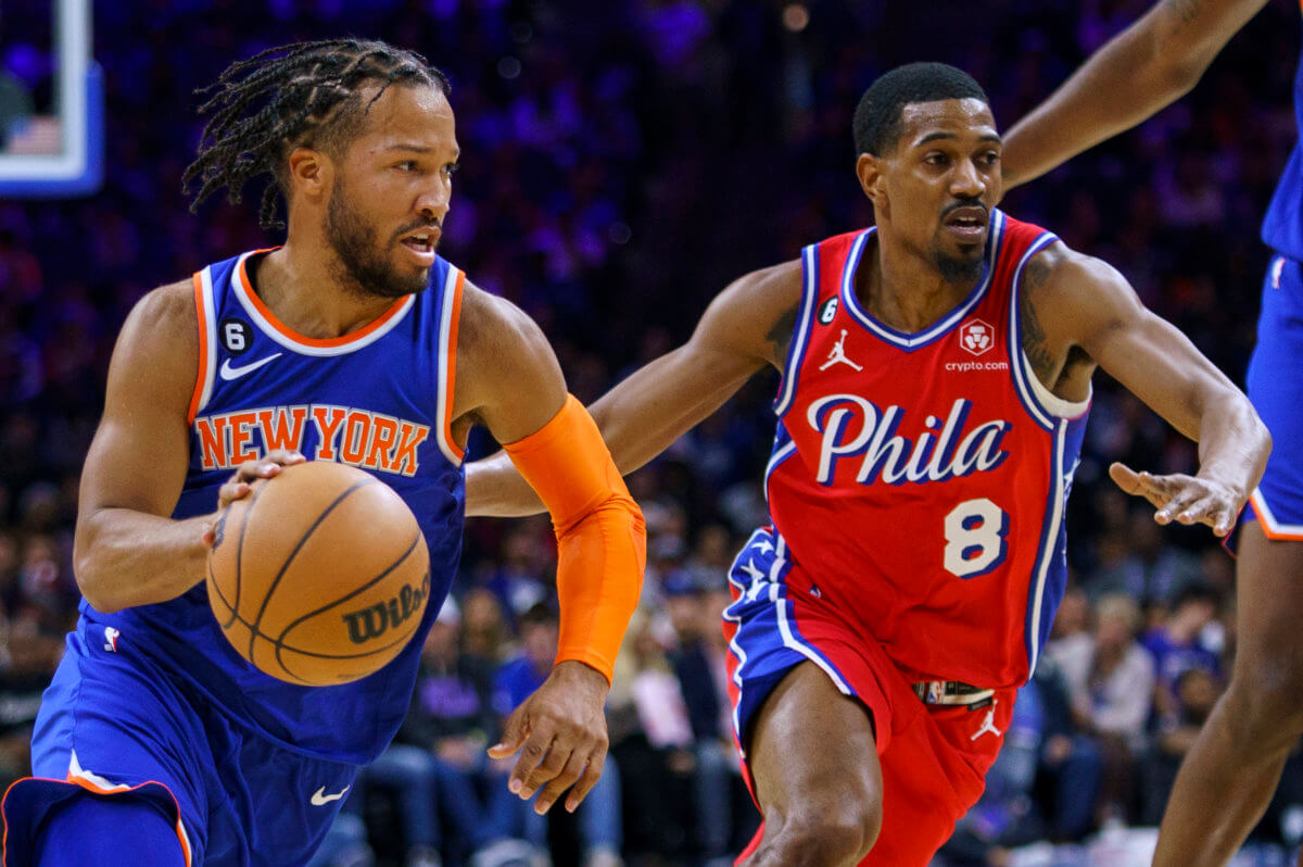 Knicks Jalen Brunson, left, drives to the basket against Philadelphia 76ers' De'Anthony Melton.