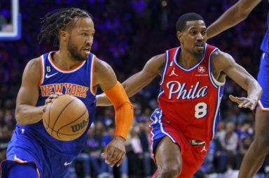 Knicks' Jalen Brunson, left, drives to the basket against Philadelphia 76ers' De'Anthony Melton.