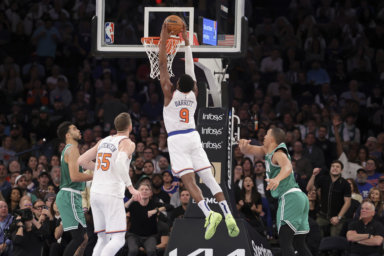 New York Knicks guard RJ Barrett (9) dunks the ball as Boston Celtics forward Jayson Tatum.