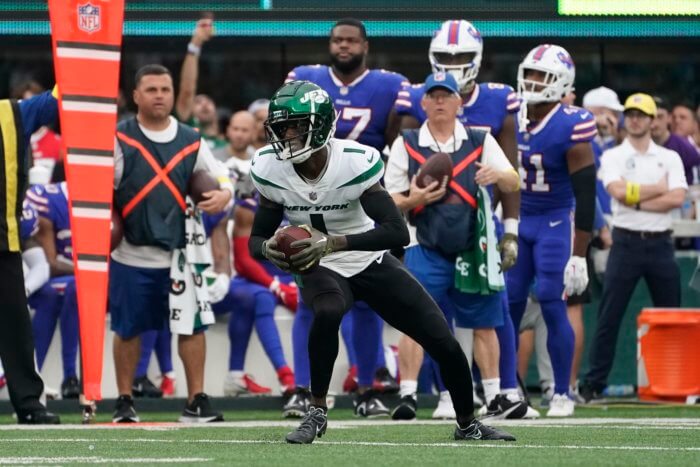 Jets cornerback Sauce Gardner runs back an interception against Josh Allen of the Buffalo Bills in Week 9.