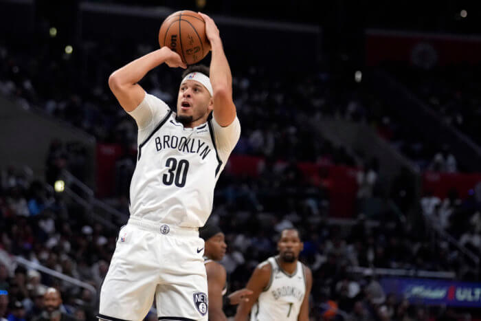 Nets head coach Jacque Vaughn is solving a Rubix's cube with his rotation 2 Nets guard Seth Curry