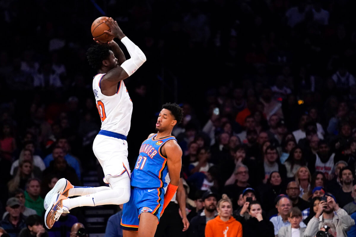Knicks forward Julius Randle jumps against Oklahoma City Thunder guard Aaron Wiggins.