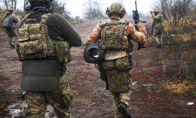 Ukrainian soldiers change their position at an undisclosed location in the Donetsk region