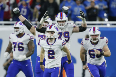 Buffalo Bills celebrate their win over the Lions