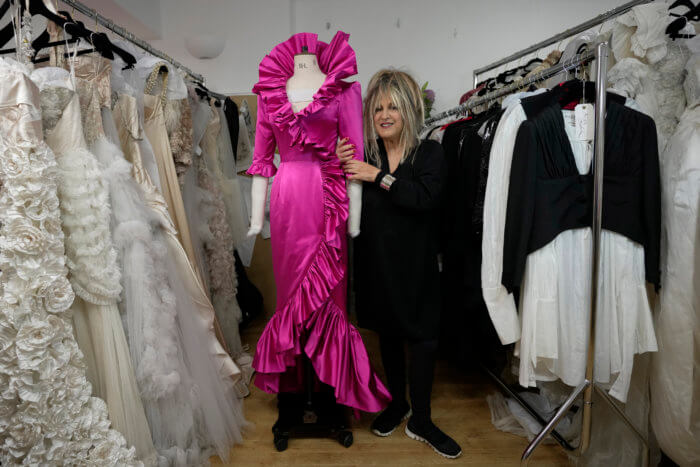 British designer Elizabeth Emanuel with dress inspired by Diana