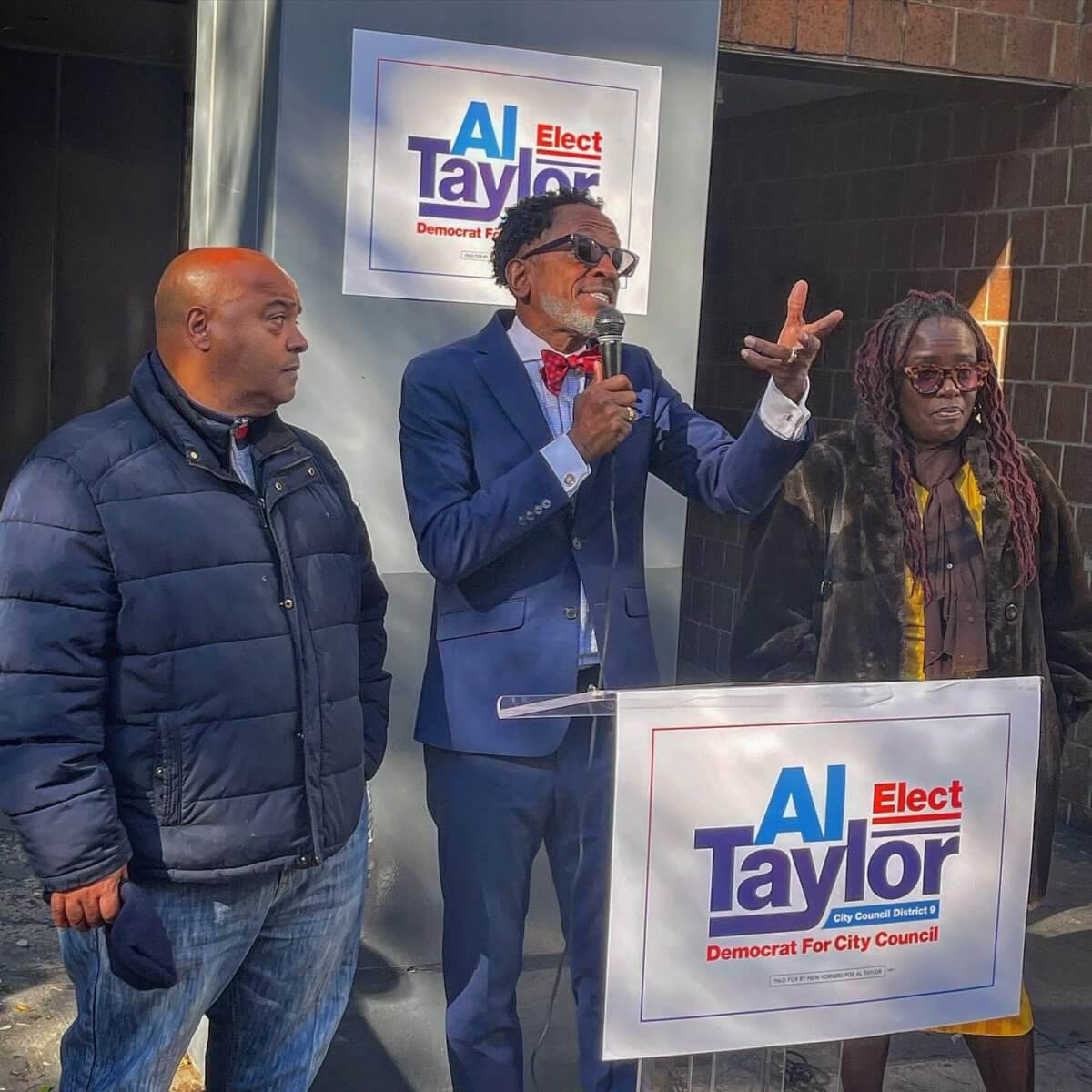 Al Taylor (center) announces his bid for Council District 9 in Harlem.