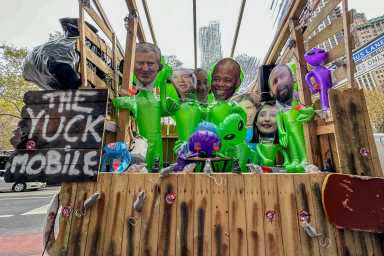 The float of politicians dining above. Rats below.