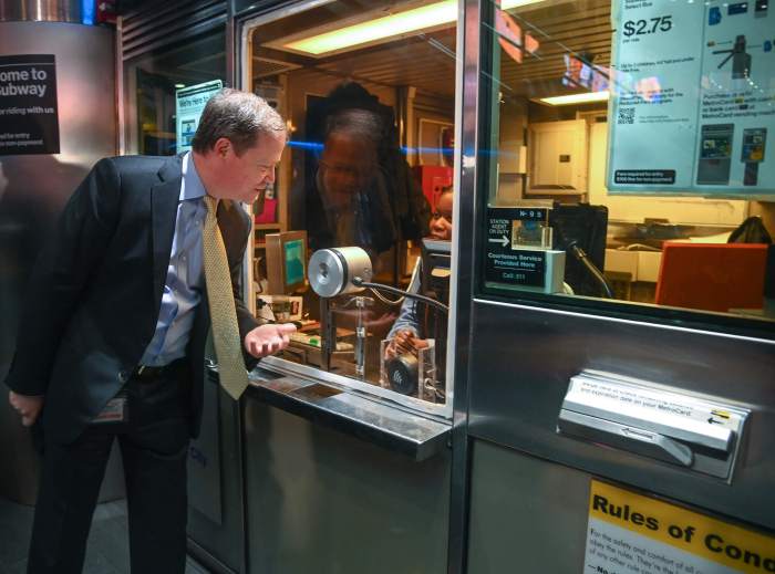 Subway station agents and MTA NYC Transit President Richard Davey