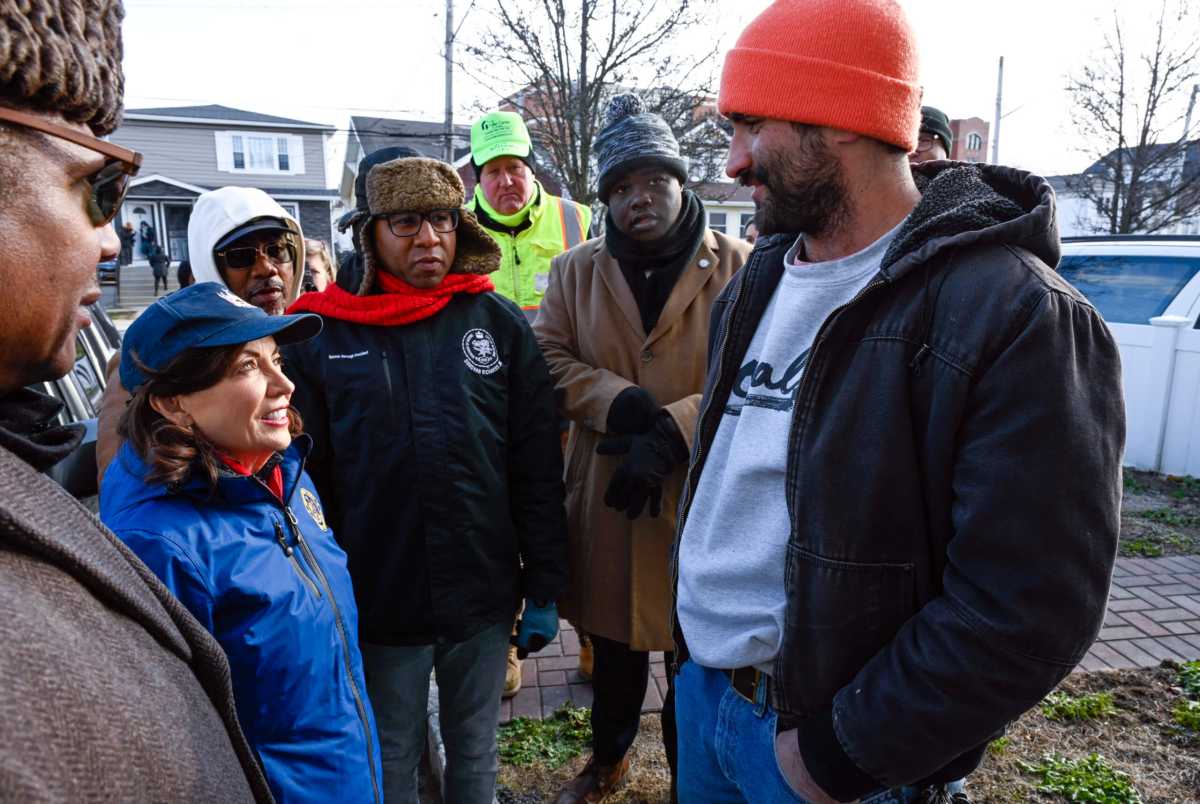 Governor Kathy Hochul speaks with residents affected by Rockaway flooding