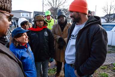 Governor Kathy Hochul speaks with residents affected by Rockaway flooding