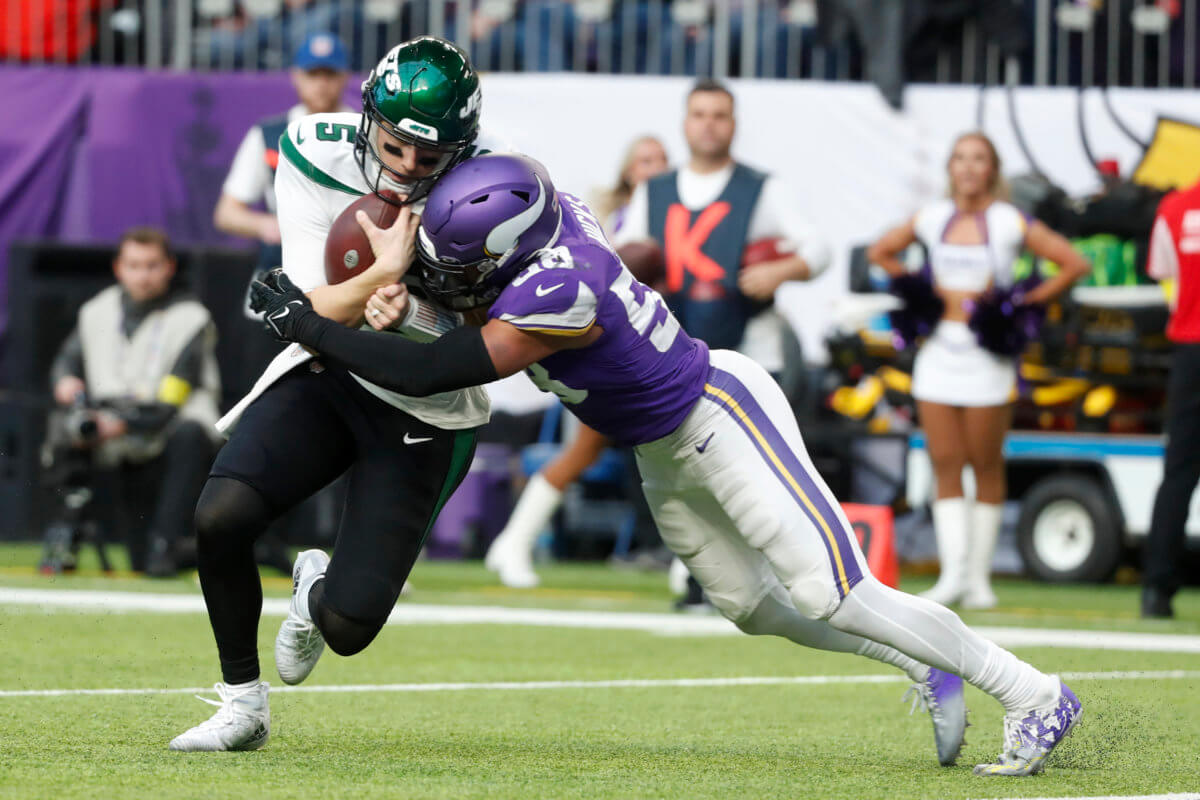 Jets quarterback Mike White is tackled by Vikings linebacker Jordan Hicks during the second half.
