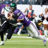Jets quarterback Mike White is tackled by Vikings linebacker Jordan Hicks during the second half.