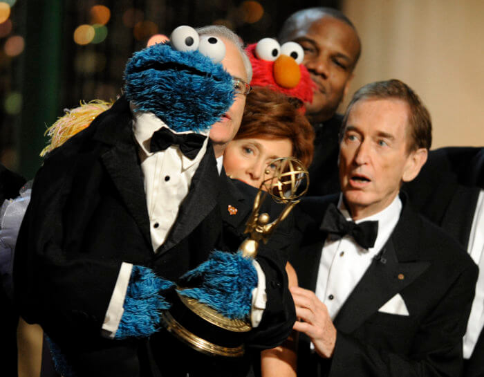 Bob McGrath, right, looks at the Cookie Monster as they accept the Lifetime Achievement Award for '"Sesame Street" at the Daytime Emmy Awards on Aug. 30, 2009, in Los Angeles