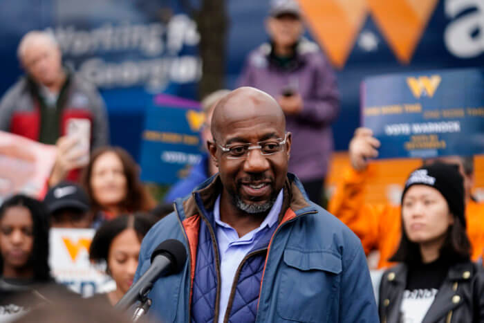 Democratic Raphael Warnock speaks during an election day canvass launch on Dec. 6.