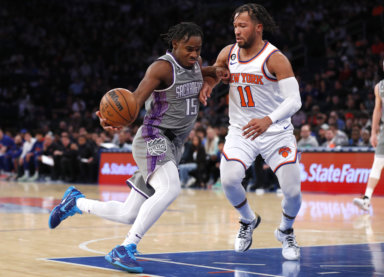 Sacramento Kings guard Davion Mitchell (15) drives to the basket against New York Knicks guard Jalen Brunson.