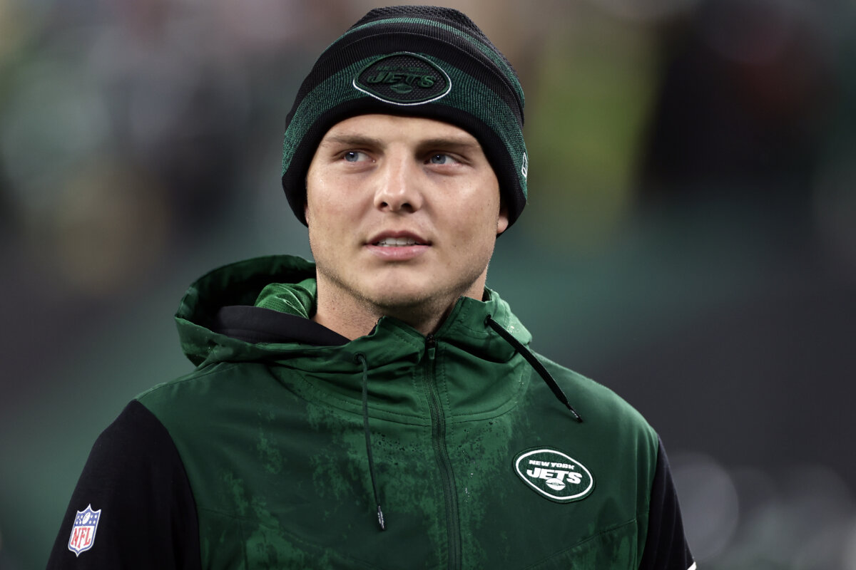 Jets quarterback Zach Wilson watches from the sidelines after he lost the starting quarterback job.