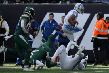 Detroit Lions wide receiver Kalif Raymond returns a punt for a touchdown against the Jets.