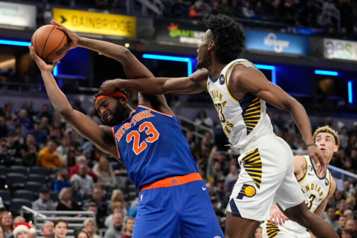 Mitchell Robinson of the Knicks battles for a rebound