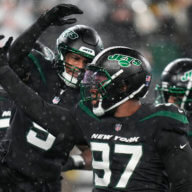 Jets linebacker Kwon Alexander (9) celebrates with defensive tackle Nathan Shepherd (97) after a defensive play against the Jacksonville Jaguars.