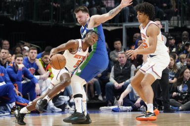 Knicks guard Immanuel Quickley drives against Dallas Mavericks guard Luka Doncic.