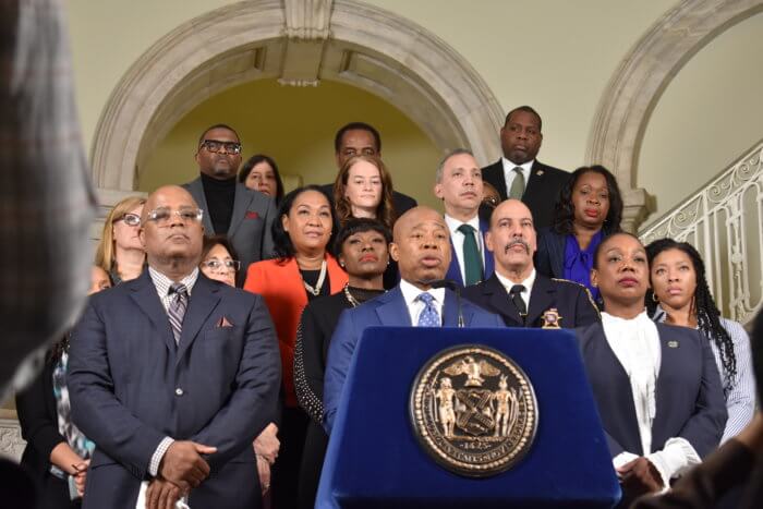 'We have much to do': Mayor Adams defends administration's record on public safety 3 Members of the Adams administration surround the mayor at City Hall on Wednesday.