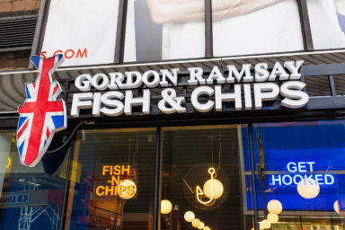 The exterior sign of Gordon Ramsay Fish & Chips in Times Square.