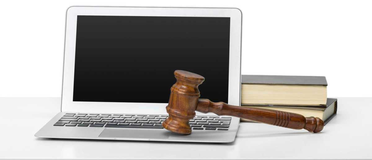 Laptop And Mallet On Table