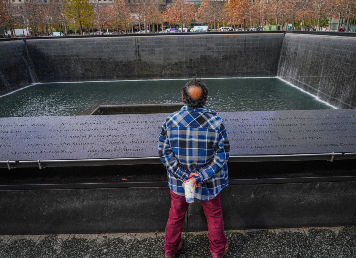 A moment of solemn reflection at the 9/11 memorial.