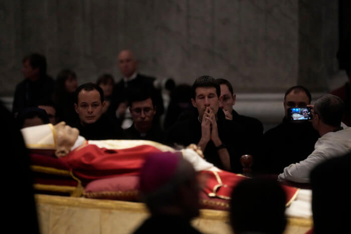Mourners view the body of Pope Emeritus Benedict XVI as it lies in state inside St. Peter's Basilica at The Vatican.