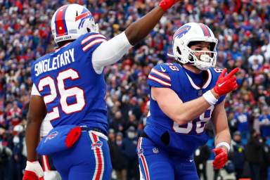 Devin Singletary and Dawson Knox celebrate a Bills touchdown