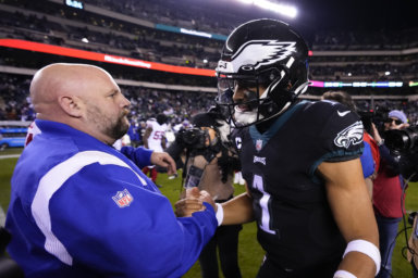 Jalen Hurts shakes hands with Giants head coach Brian Daboll