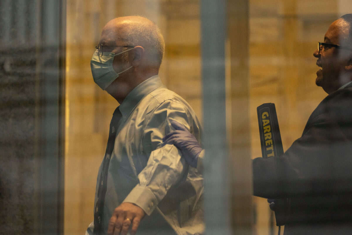 ex-New York doctor Robert Hadden waits in line at the federal court