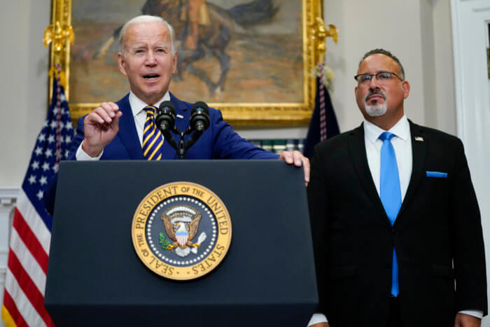 President Joe Biden speaks about student loan debt forgiveness in the Roosevelt Room of the White House