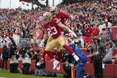 The 49ers celebrate a touchdown in their win over the Seahawks and will now face the Eagles